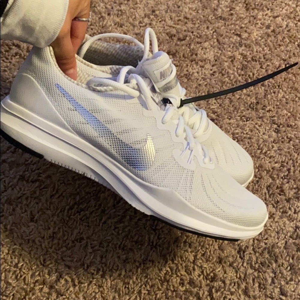 white athletic nike shoes